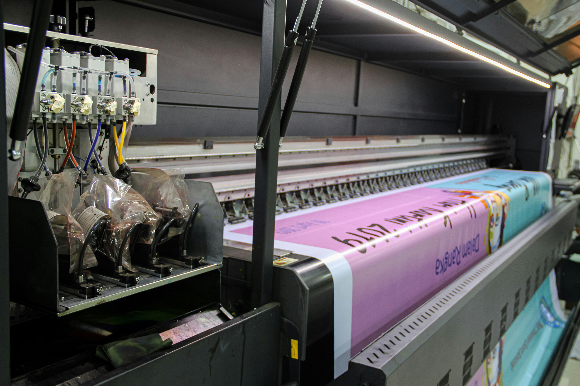 Print shop workspace with industrial equipment